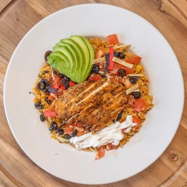 Frends Brewhouse's chicken and rice bowl with avocado, black olives, tomatoes, and sour cream.